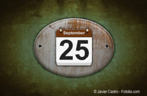 Old wooden calendar with September 25.
