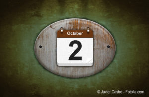 Old wooden calendar with October 2.